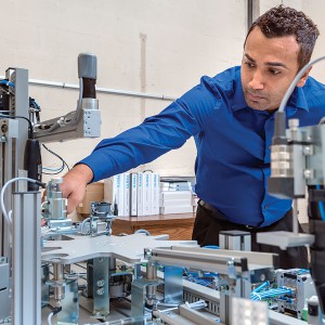 Graduate student Sam Chatterjee in the Mechatronics lab in Voorhies Engineering Technology Building.
