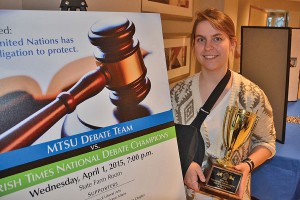Leigh Stanfield, a junior communications studies major from Soddy Daisy, Tennessee, holds the trophy for the novice division title she won during the MTSU Debate Team’s participation in the International Public Debate Association’s National Championship Tournament and Convention held March 27-29 at Boise State University.