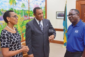 MTSU President Sidney A. McPhee, right, meets with the Commonwealth of the Bahamas Prime Minister Perry G. Christie, center, and Allyson Maynard Gibson, left, attorney general and minister of legal affairs of the Bahamas, just before the Blue Raiders men's basketball team played Thursday, Aug. 13, 2015, in the first of three preseason exhibition games at the Commonwealth’s national gymnasium. (MTSU photo)