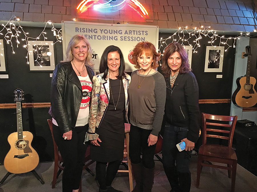 The Change the Conversation group recently launched its mentoring sessions for young artists at the Bluebird Café in Nashville, Tennessee. Pictured, from left, are Beverly Keel, chair of MTSU's Department of Recording Industry and co-founder of Change the Conversation; Leslie Fram, CMT senior vice president and Change the Conversation co-founder; country music legend and special guest Reba McEntire; and Tracy Gershon, Rounder Records Group's vice president of A&R and Change the Conversation co-founder. (Photo courtesy of Justin McIntosh)