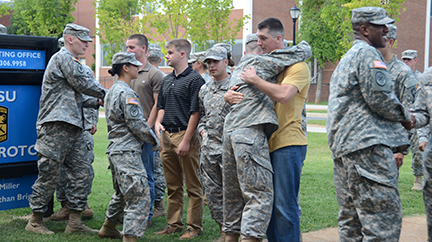 Current MTSU ROTC cadets offer congratulations to four of nine newly contracted cadets Aug. 22 during the ROTC contracting oath ceremony outside Forrest Hall. 